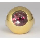 Garnet, rock crystal quartz, 18k yellow gold ring Featuring (1) round-cut garnet, underneath a