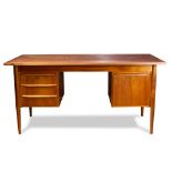 Danish Modern Gunnar Nielsen Tibergaard teak desk, having a rectangular top, above the four drawer