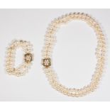 Cultured pearl, emerald, gold convertible necklace-bracelet Including 1) necklace, composed of (106)