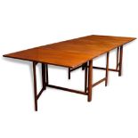 A Danish Modern expanding table, in the manner of Bruno Mathsson, having a rectangular top above