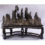 A Chinese scholar's rock, mounted as mountains, size (with stand) : 18.5"h x 8.5"w x 20"l
