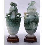 (lot of 2) A pair of Chinese archaistic hardstone lidded vases, the body flanked with a pair of