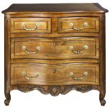 A Louis XV style chest, having a shaped top above the four drawer case and rising on short