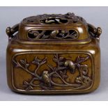 Japanese patinated bronze hand warmer, Meiji-Taisho period, rounded rectangular form with handle,
