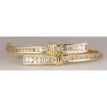 Diamond, 14k yellow gold bracelet Featuring (15) baguette-cut and (28) full-cut diamonds, weighing a