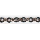 Diamond, blackened silver bracelet Featuring numerous treated blue and brown diamonds, weighing a