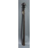 A Fijian pole club, with black, knobbed head and abrasions at the striking end, 33"h