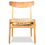 Hans Wegner for Carl Hansen and Son side chair, having an original woven grass seat and rising on