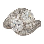 Diamond, platinum ring Featuring (2) transitional-cut diamonds, each weighing approximately 1.00