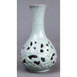 A Chinese Guan style reticulated double vase, of pear-shaped body with a tapering neck, the exterior