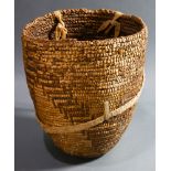 A Pacific Northwest American Indian imbricated and coiled berry basket with a round base, and a