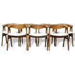 (lot of 7) Danish Modern teak dining chairs, each having a shaped back continuing to curved arms,