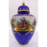 Royal Vienna style German lidded urn, having gilt decoration above a cobalt ground, continuing to