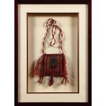 Framed Nazca coca leaf bag of brightly dyed wool with a silver colonial era style pin, in a walnut