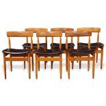 (lot of 6) Danish Modern dining chairs, each having a shaped back above a black upholstered seat,