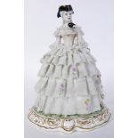 Italian Capodimonte style crinoline figural sculpture depicting a young lady grasping a mask, 9.5"h