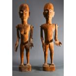 (lot of 2) Pair of Oceanic male and female carved wood dolls