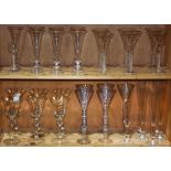 Two shelves of stemware including swirl stemware