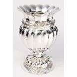 A Continental Baroque style sterling silver urn