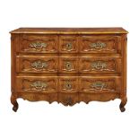 A Louis XV fruitwood commode en arbalete