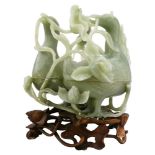 A Chinese jade carving of two conjoined duck-form boxes and lotuses