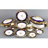 A partial gilt set of Limoges France table service