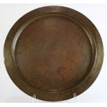 A large Harry Dixon Arts and Crafts hammered copper charger