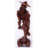 A wood carved Chinese fisherman