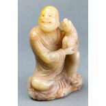 A Chinese carved hardstone figure of luohan