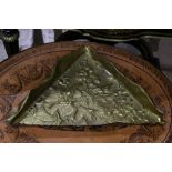 An Arts & Crafts style triangular brass tray