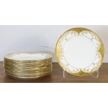 A group of Coalport partial gilt porcelain service plates