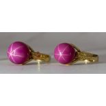 (Lot of 2) Synthetic star ruby bead, 14k yellow gold rings