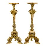 A pair Louis XIV style parcel gilt and carved wood torchieres