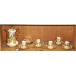 Limoges demitasse set, including cups and saucers and a coffee pot