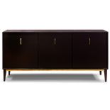 A Milo Baughman black lacquer and brass credenza