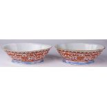 (lot of 2) A pair pf copper red lobed bowls