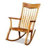 A Michael Neiman American studio sculpted cherry rocking chair