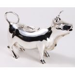Silver cow form pitcher