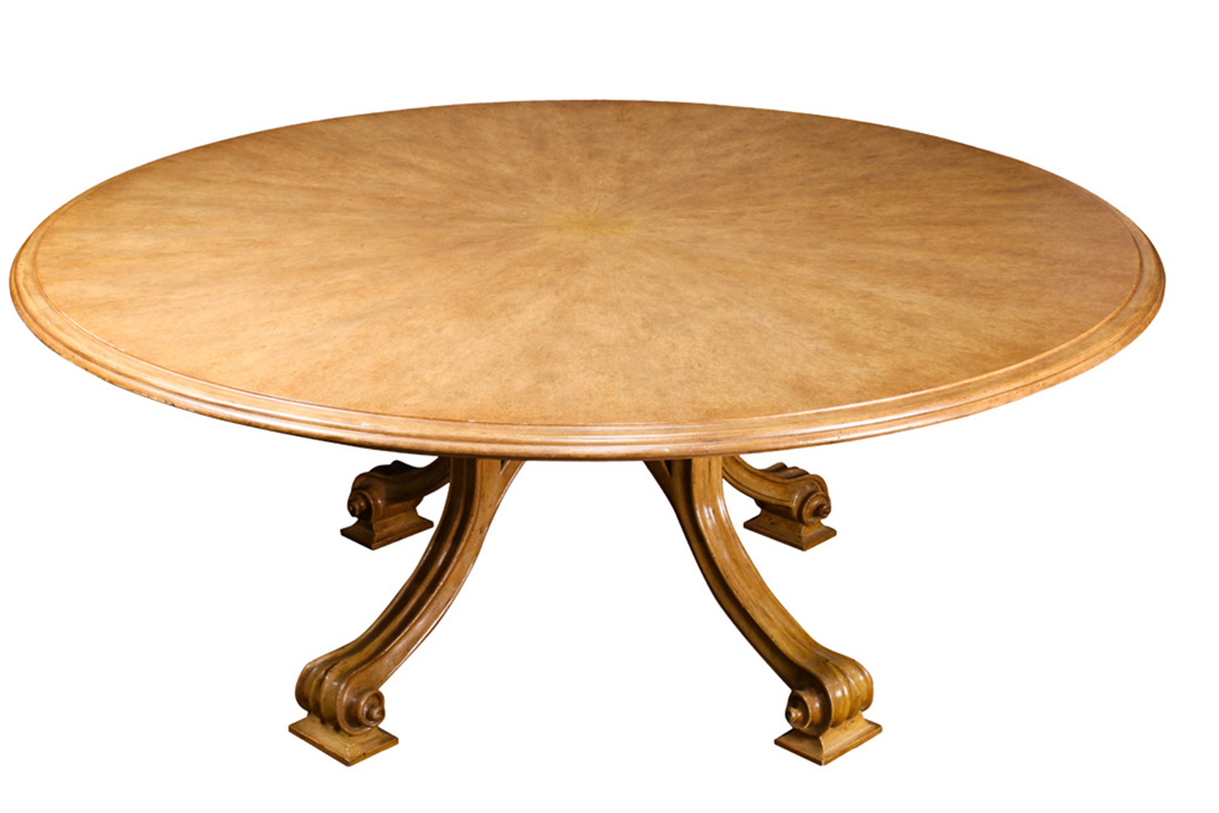 A Therien Studio Volute walnut circular dining table in the Italian Rococo style, the outset round