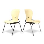 (lot of 2) A group of Gideon Kramer Ion chairs, each having a cream seat and back, and rising on