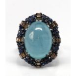 Aquamarine, diamond, sapphire, blackened silver ring Featuring (1) oval aquamarine cabochon,