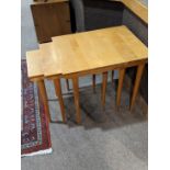 A set of Mid Century Russel Wright for Conant Ball nesting tables, each having a rectangular top and