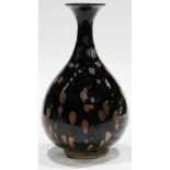 A Chinese Black Glazed Russet Splashed Yuhuchun Vase, of pear-shaped body rising to a tapering