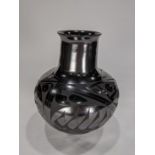 Native American blackware pottery vase, signed indistinctly on underside, 8"h
