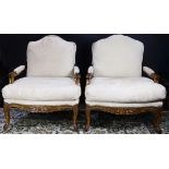 A pair of oversize fauteuils by Kreiss Collection, the large form with loose cushions, and rising on