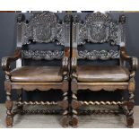 A pair of French Renaissance style armchairs circa 1850, each having figural stiles flanking the