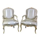A pair of period Louis XV fauteuils circa 1750, having a polychrome and partial gilt decorated frame
