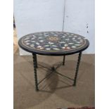 A contemporary pietra dura mixed marble conservatory table, of circular form with floral reserves