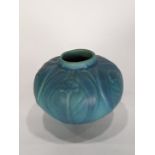 An Arts and Crafts Van Briggle art pottery vase, the two color bulbous form with stylized peacock