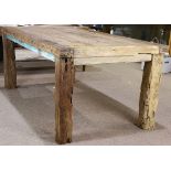 Reclaimed wood dining table, having a rectangular top above chunky square legs, 30"h x 73.5"w x 39"d
